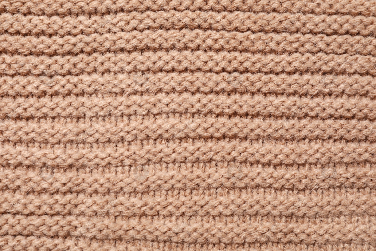 Photo of Surface of winter clothing as background, closeup