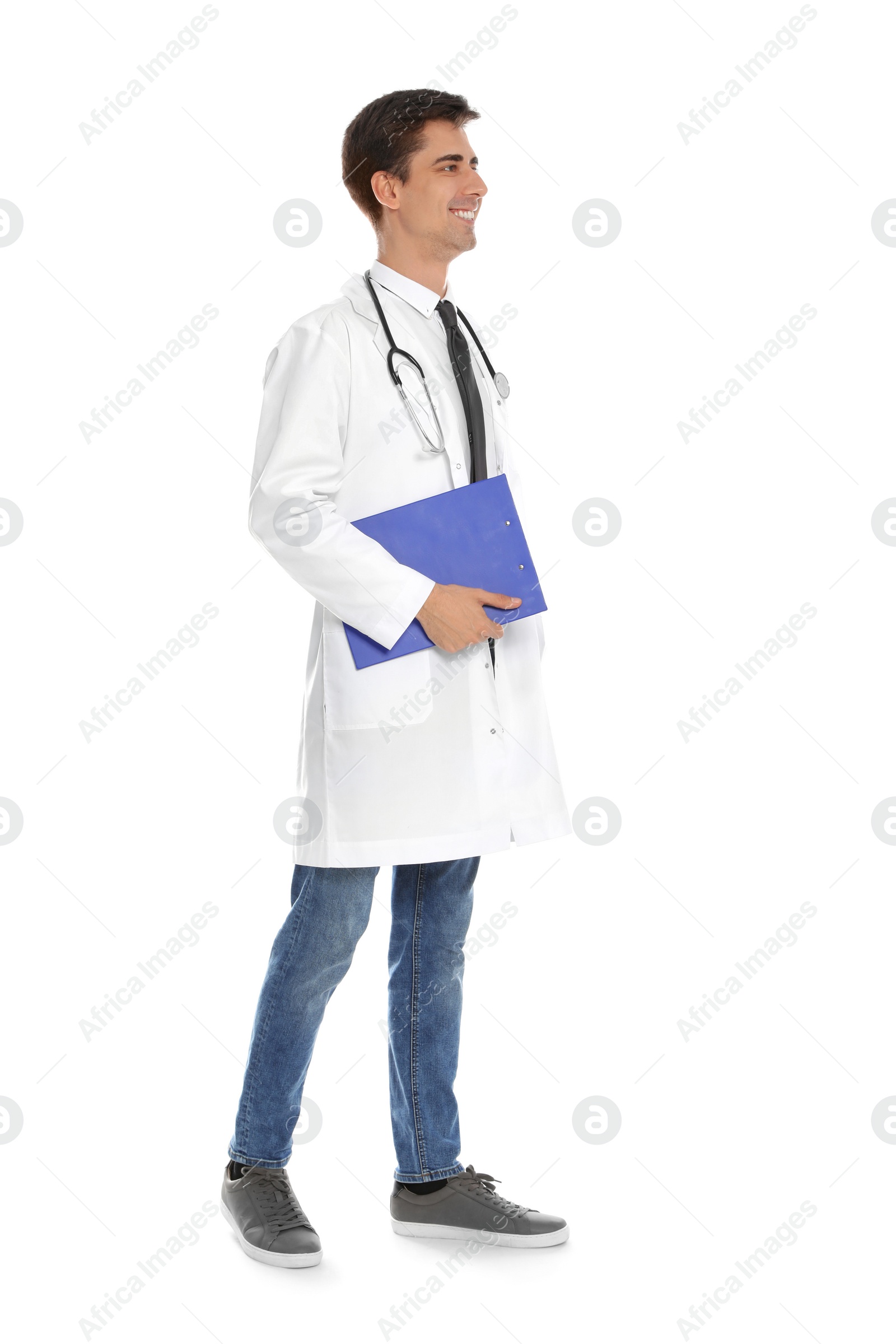 Photo of Full length portrait of medical doctor with clipboard and stethoscope isolated on white