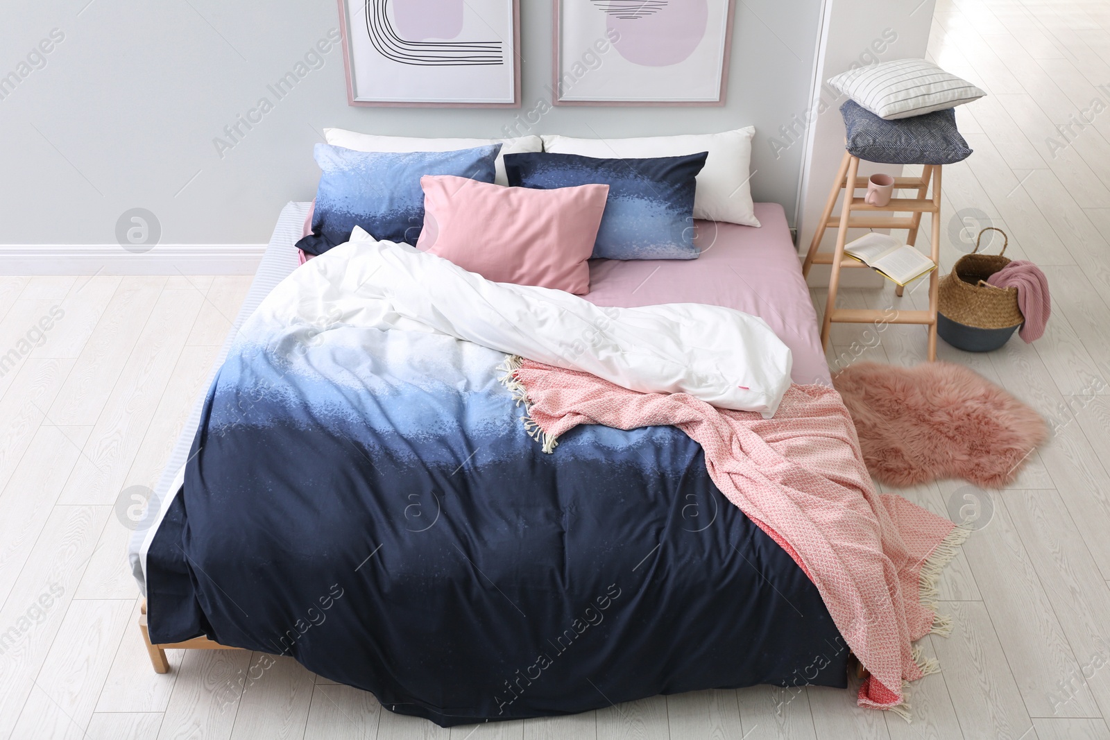 Photo of Comfortable bed with stylish linens in room, above view