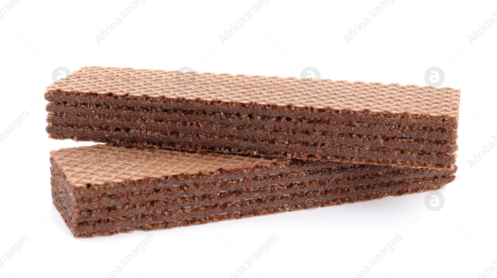 Photo of Delicious crispy wafers on white background. Sweet food