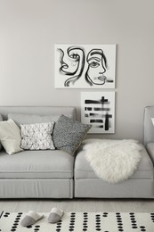 Cozy living room interior with big grey sofa