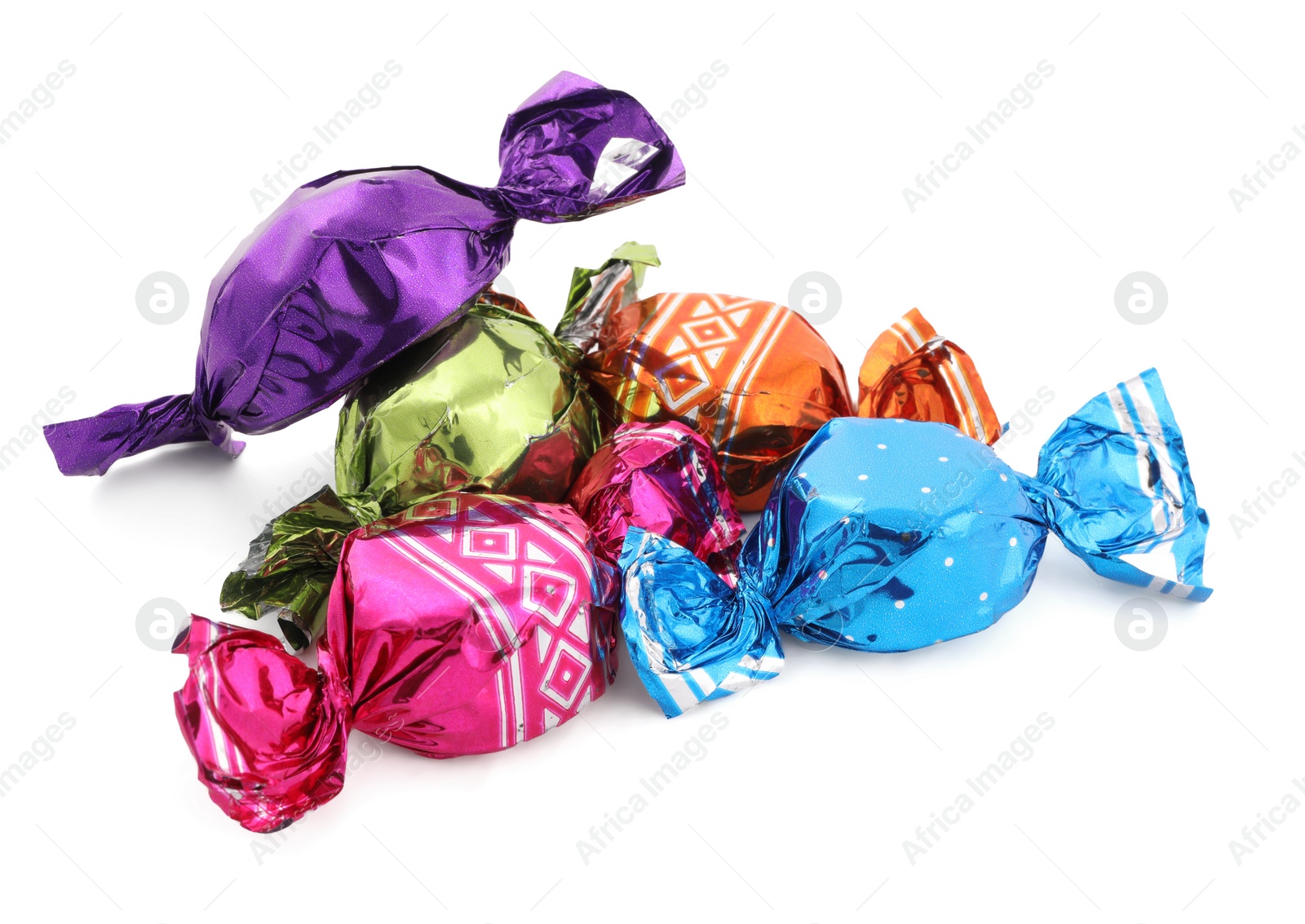 Photo of Sweet candies in colorful wrappers on white background