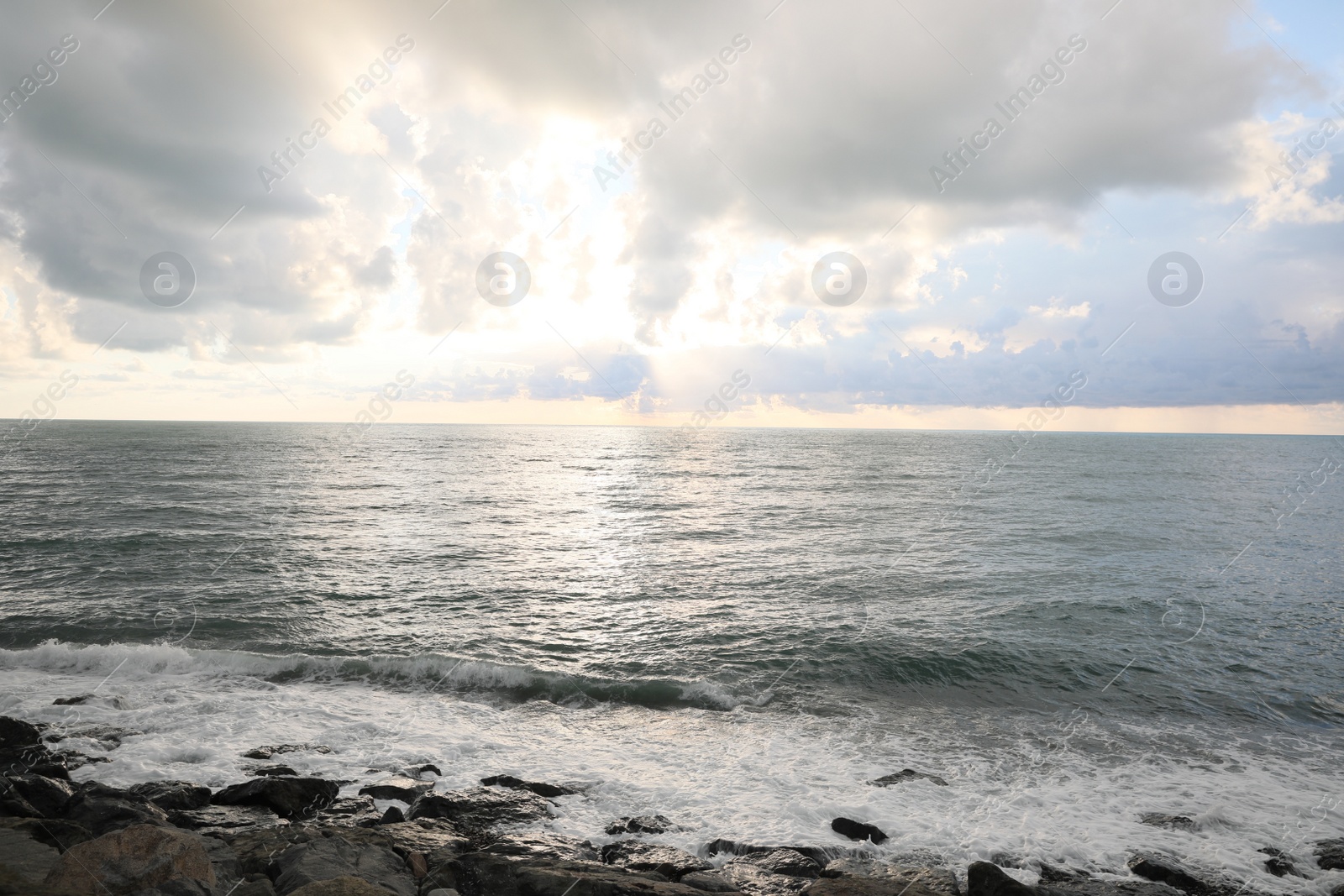 Photo of Picturesque view of sky with heavy rainy clouds over sea