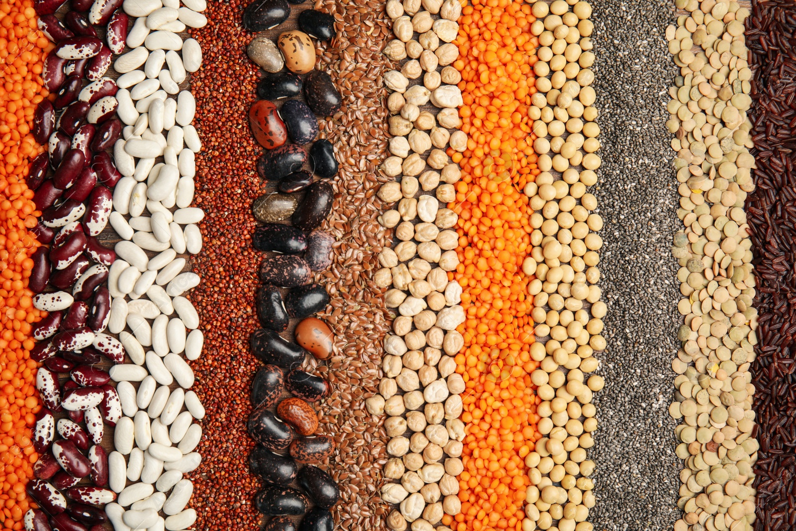 Photo of Different grains and seeds as background, top view. Veggie diet