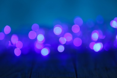 Photo of Beautiful abstract background with blurred violet Christmas lights