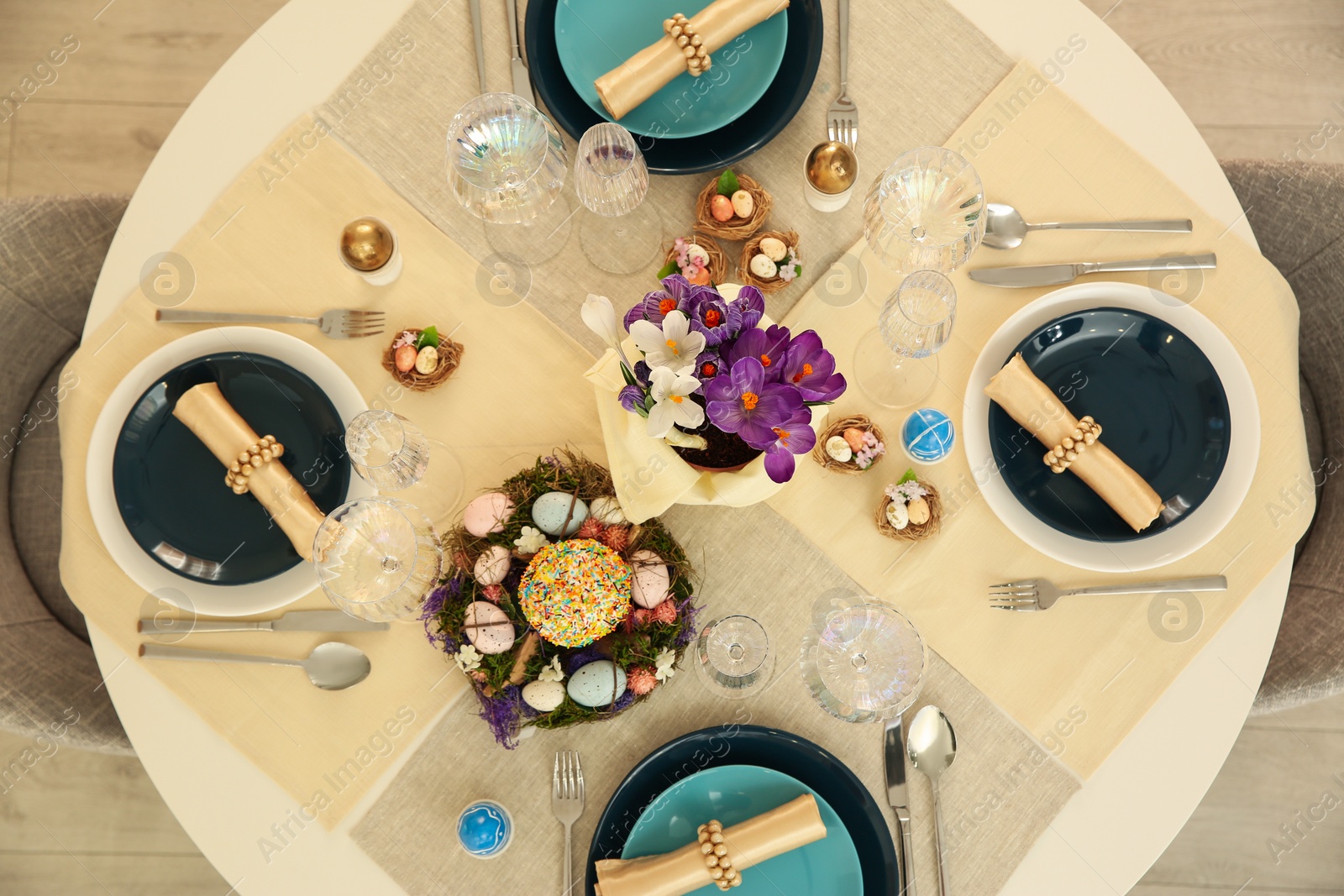 Photo of Festive Easter table setting with decorated eggs, flat lay