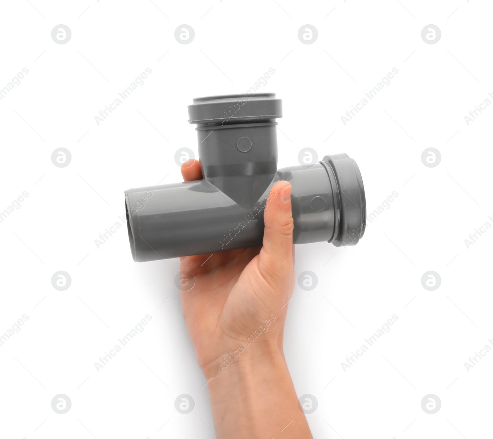 Photo of Plumber holding pipe fitting on white background, closeup