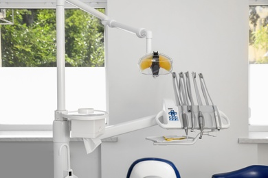 Photo of Set of professional equipment in dentist's office