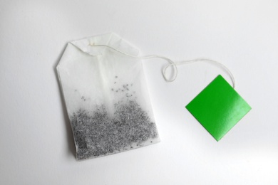 Tea bag on white background, top view