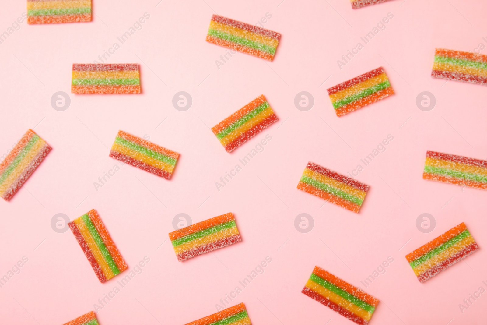 Photo of Flat lay composition with yummy candies on color background