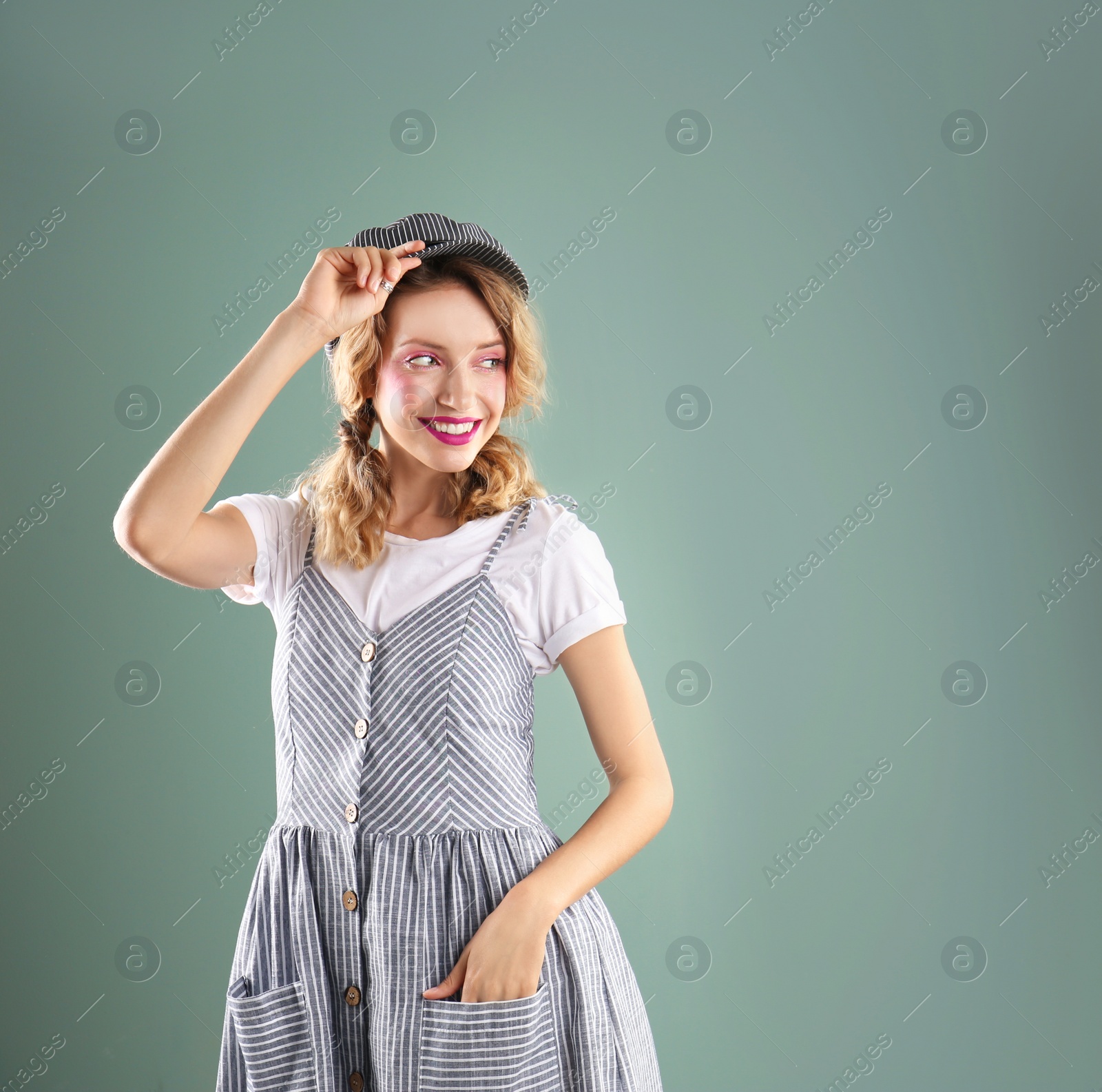 Photo of Beautiful young woman posing on color background. Summer fashion