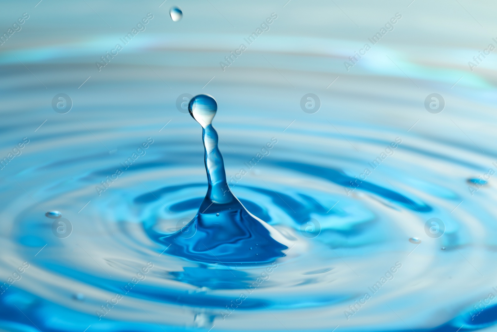 Photo of Splash of clear water with drops as background, closeup