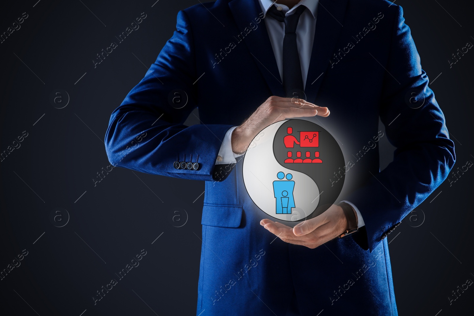 Image of Businessman showing balance between life and work on dark background, closeup