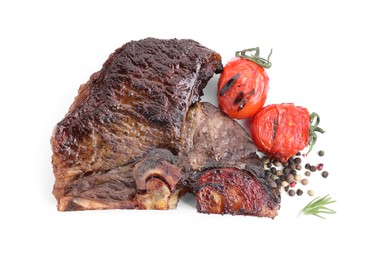 Photo of Piece of delicious grilled beef meat, tomatoes, peppercorns and rosemary isolated on white, top view