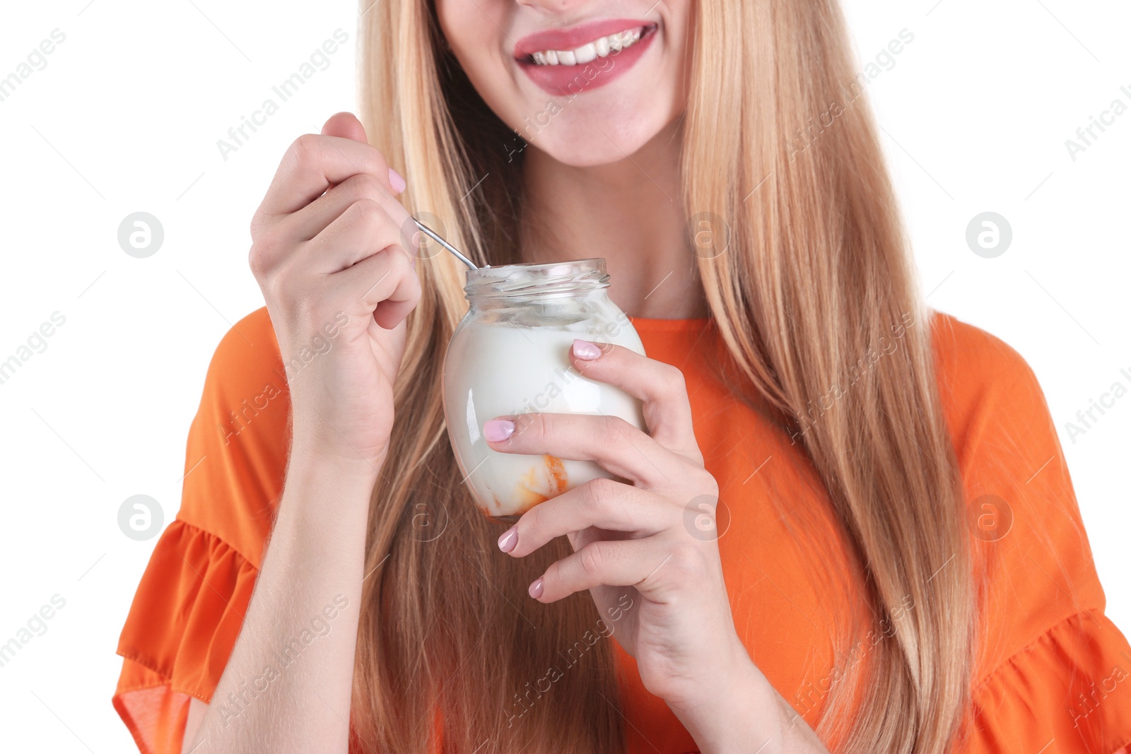 Photo of Young woman with yogurt on white background, closeup