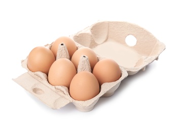 Photo of Carton of raw chicken eggs on white background