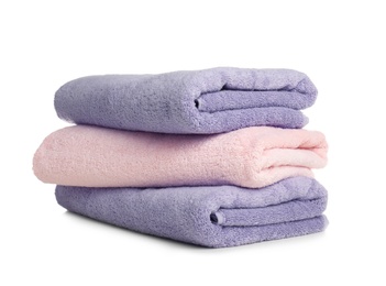 Photo of Folded soft terry towels on white background