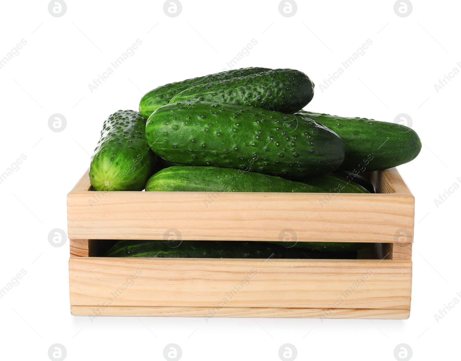 Photo of Wooden crate full of fresh ripe cucumbers on white background