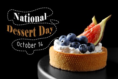 Image of National Dessert Day, October 14. Tartlet with blueberries and figs on black cake stand dark background, closeup