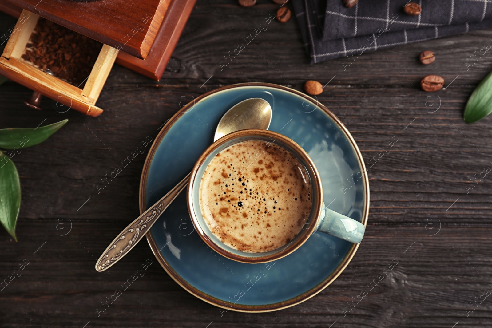 Photo of Flat lay composition with cup of aromatic hot coffee on wooden table