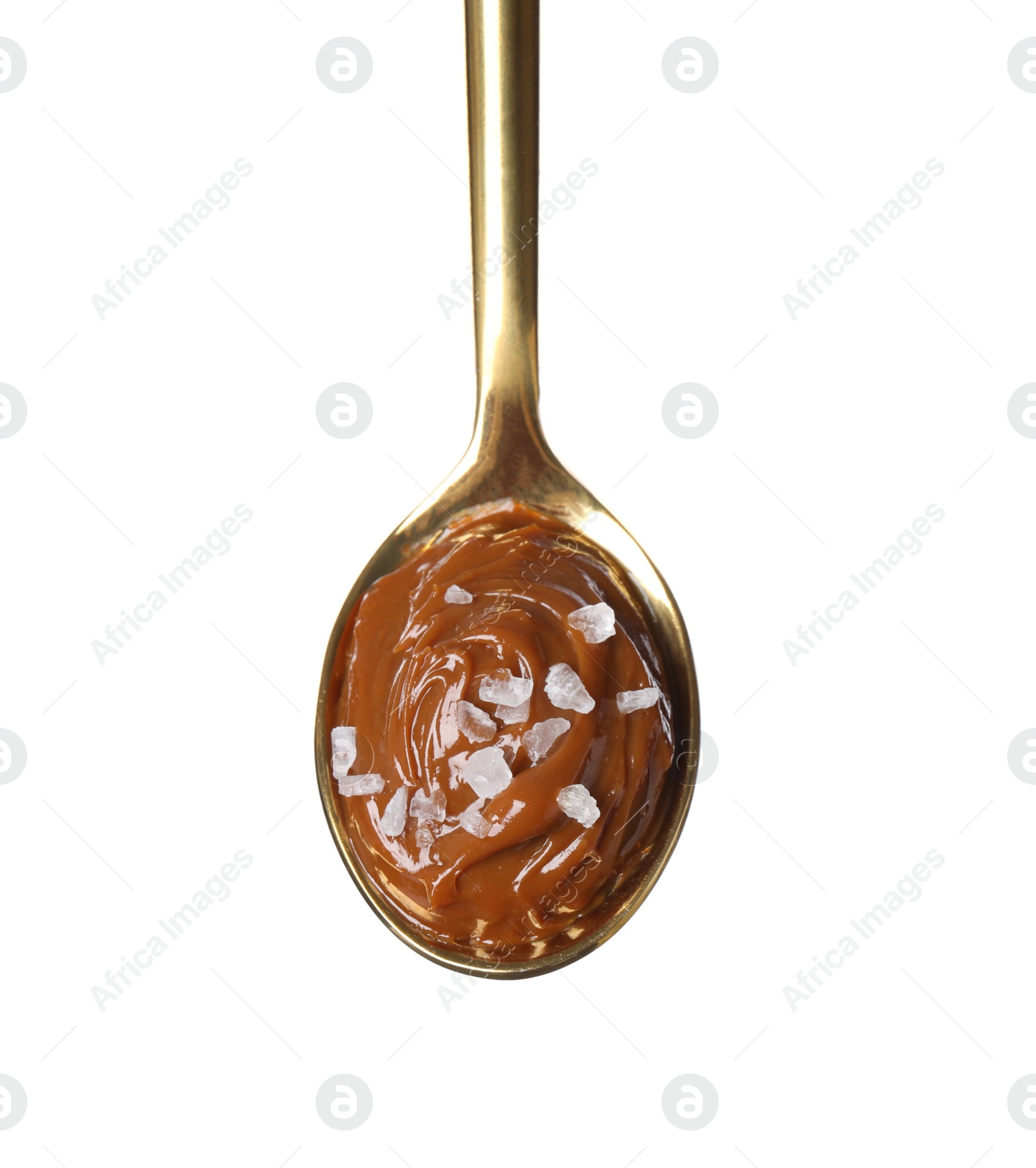 Photo of Salted caramel in spoon isolated on white