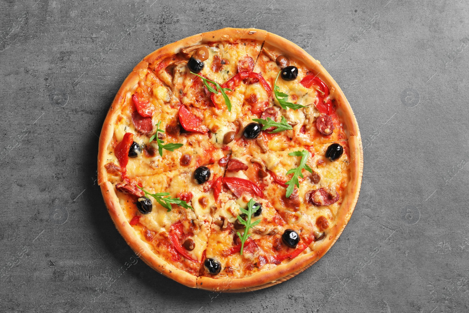Photo of Delicious pizza with olives and sausages on table, top view
