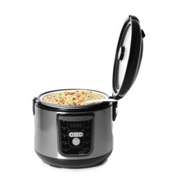 Photo of Delicious rice with vegetables and spoon in modern multi cooker on white background