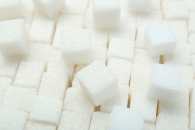 Photo of White sugar cubes as background, closeup view