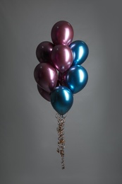 Photo of Bunch of color balloons on grey background