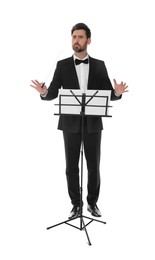 Photo of Professional conductor with baton and note stand on white background