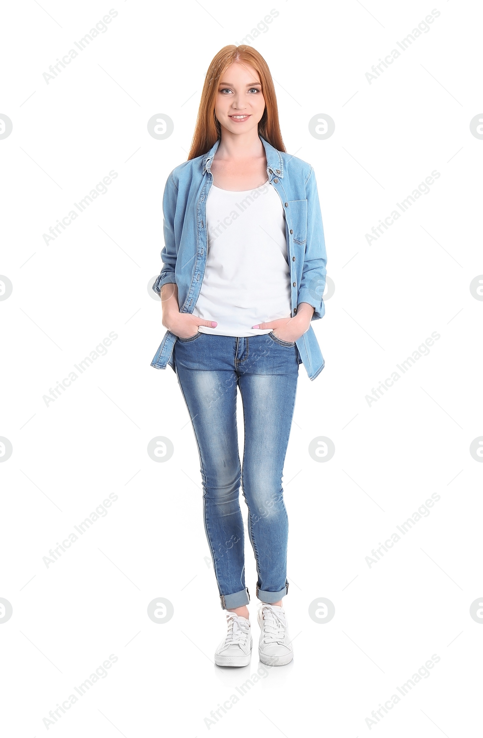 Photo of Young woman in stylish jeans on white background