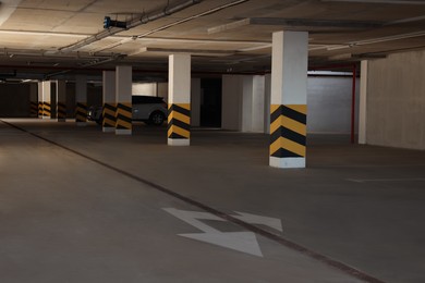 Parking garage with car and vacant slots