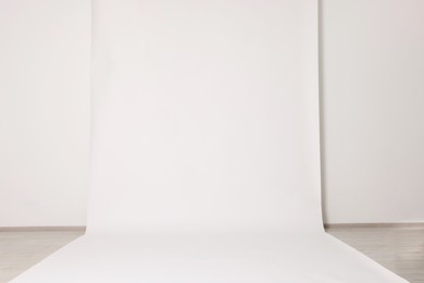 Photo of Modern white photo background. Professional studio equipment