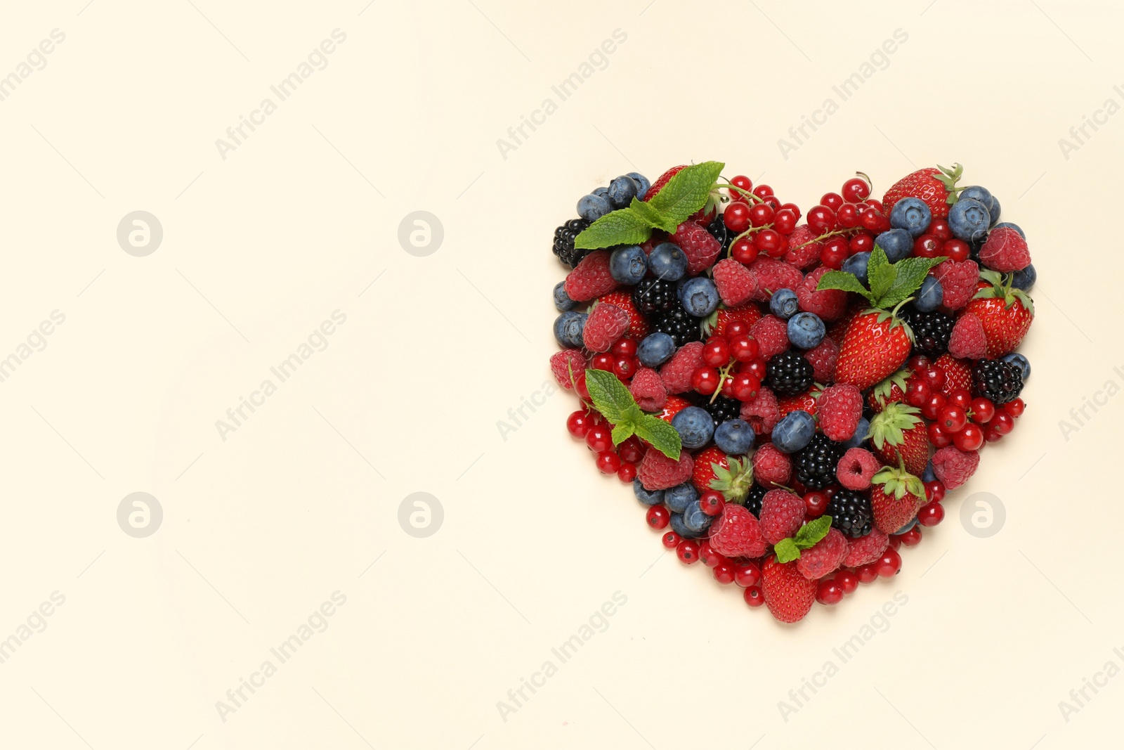 Photo of Mix of different fresh berries and mint on light background, flat lay. Space for text