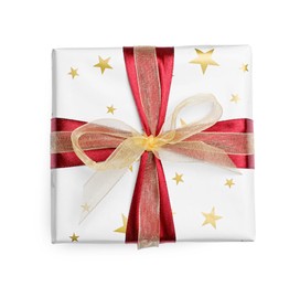 Christmas gift wrapped in star patterned paper on white background, top view