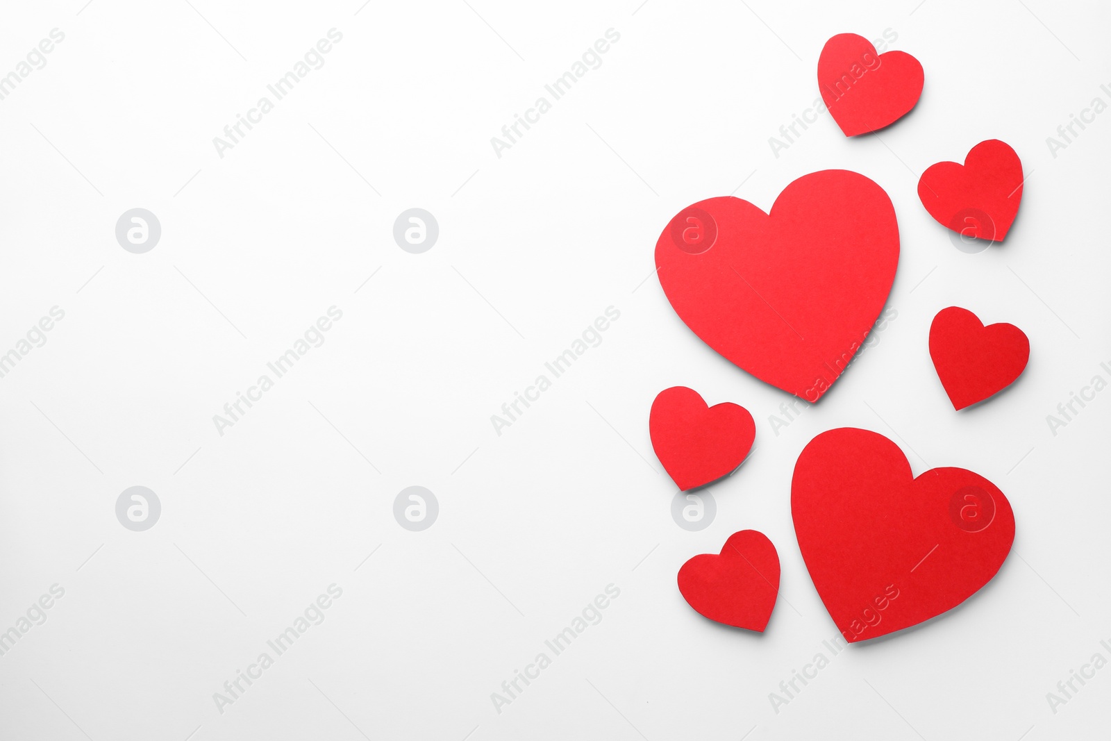 Photo of Paper hearts on white background, flat lay. Space for text