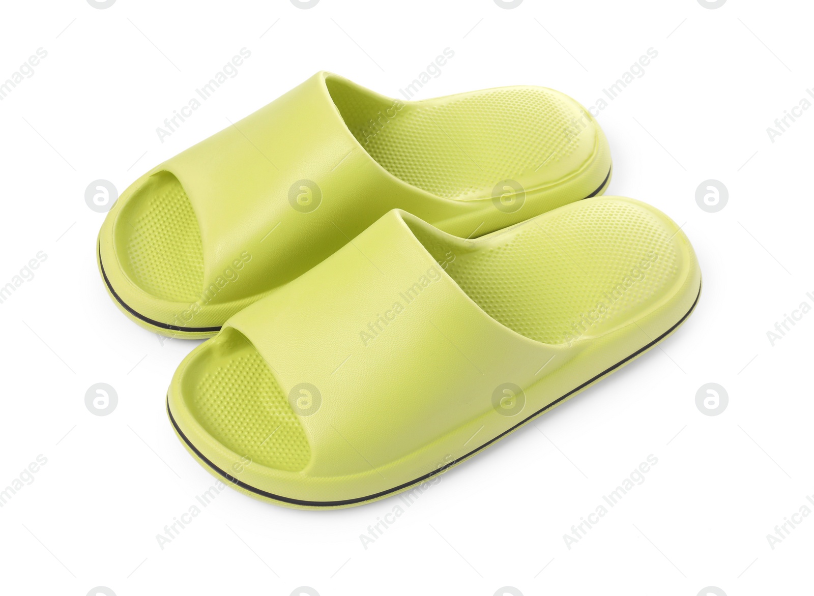 Photo of Pair of green rubber slippers isolated on white