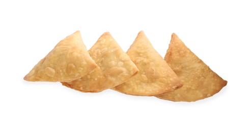 Photo of Fresh delicious crispy samosas on white background, top view