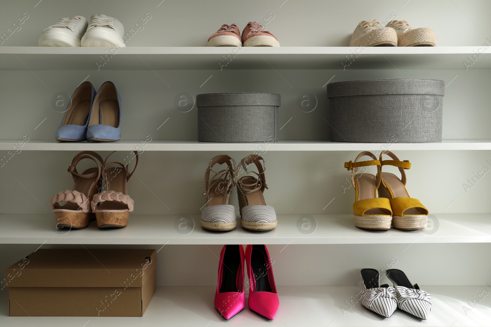 Photo of Storage rack with different stylish women's shoes