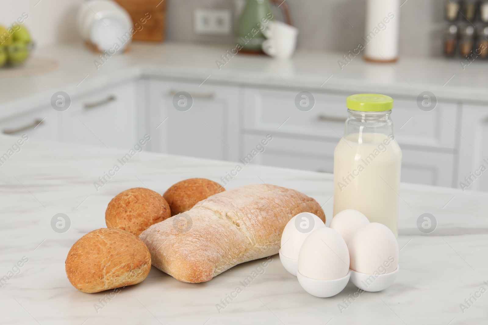 Photo of Allergenic food. Different fresh products on light marble table in kitchen