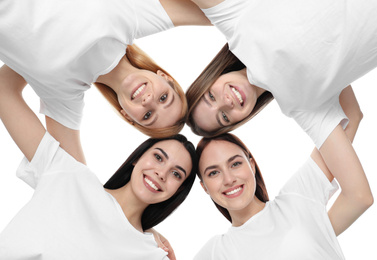 Photo of Beautiful young ladies hugging on white background, bottom view. Women's Day