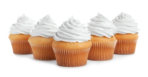 Photo of Delicious cupcakes decorated with cream on white background