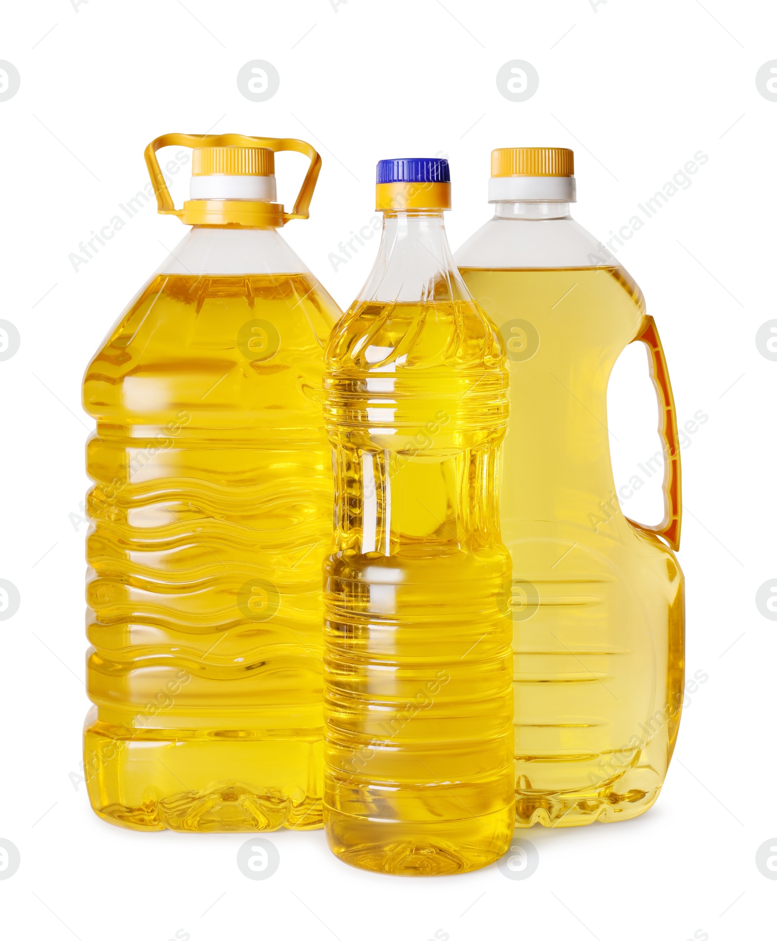 Photo of Bottles of cooking oil on white background