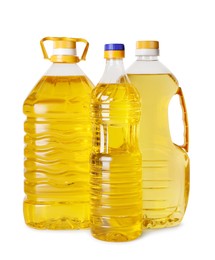 Bottles of cooking oil on white background