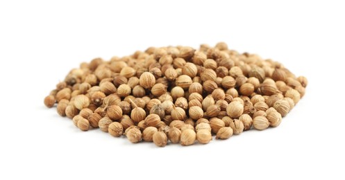 Heap of dried coriander seeds on white background