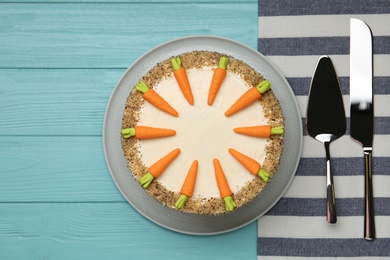 Photo of Flat lay composition with delicious carrot cake on blue wooden background