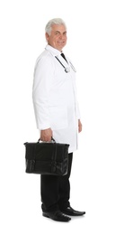 Photo of Full length portrait of male doctor with briefcase isolated on white. Medical staff