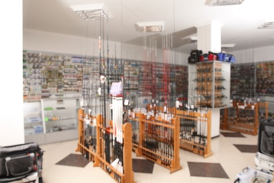 Blurred view of sports shop with fishing equipment