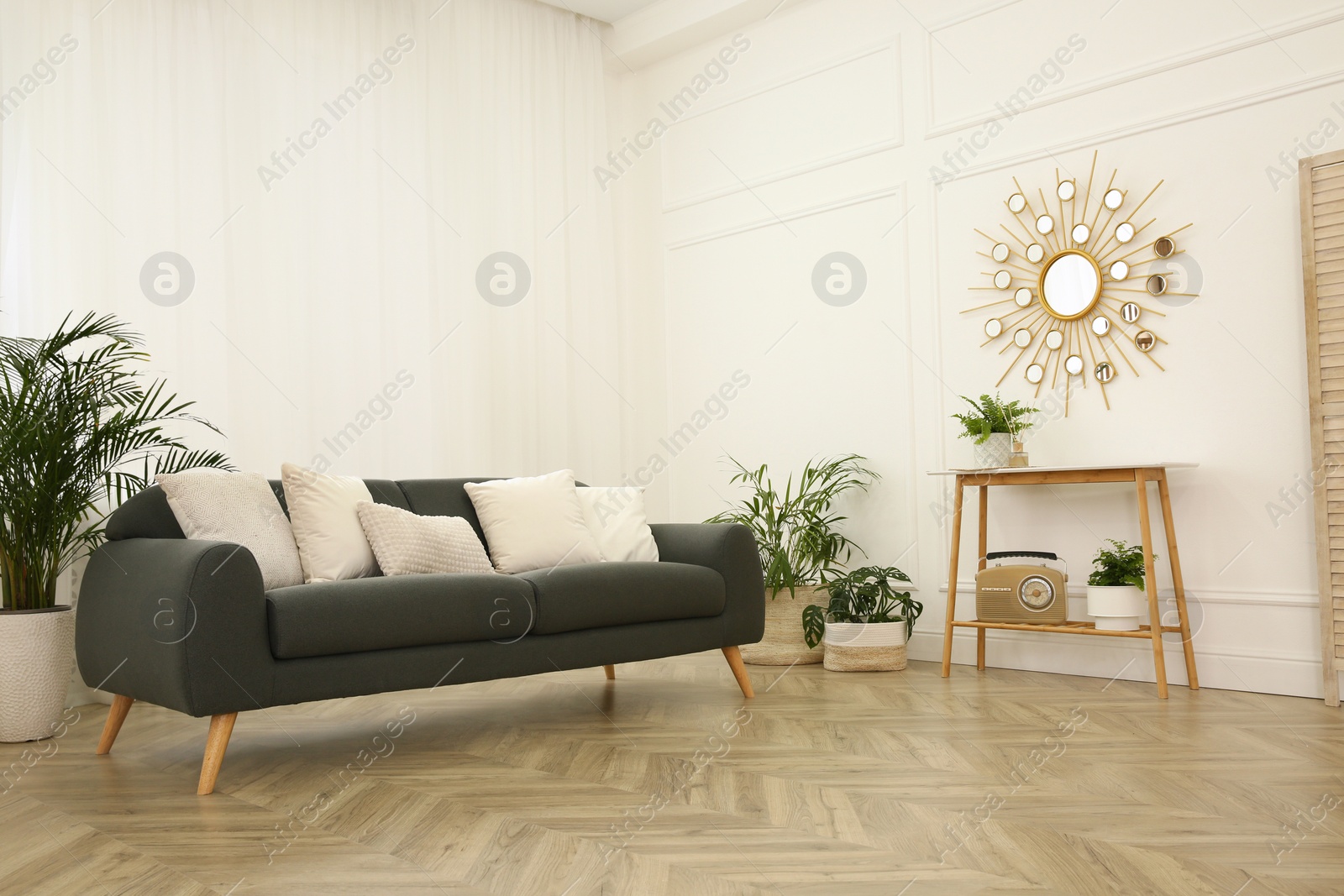 Photo of Stylish living room interior with comfortable sofa