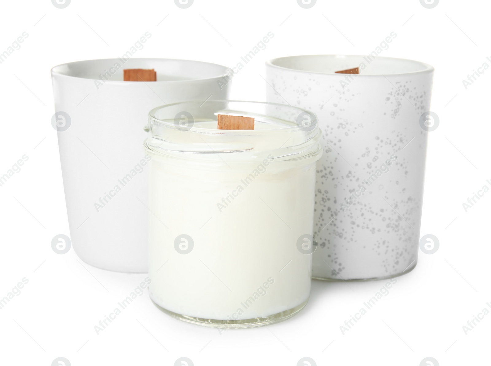 Photo of Beautiful candles with wooden wicks on white background